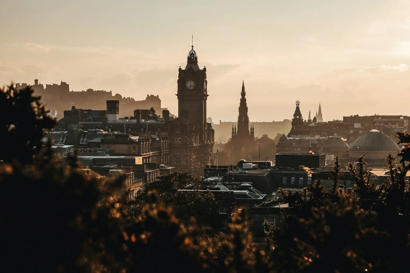 Edinburgh rooftops and historic towers in evening light